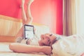 Girl on bed with ipad