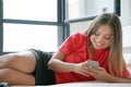 Girl in bed with a smartphone Royalty Free Stock Photo