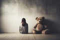 girl behind body with teddy bear sitting and facing an empty white wall in classroom. AI Generated