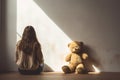 girl behind body with teddy bear sitting and facing an empty white wall in classroom. AI Generated