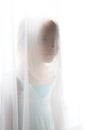 Girl behind the curtain Royalty Free Stock Photo