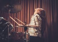 Girl behind drums on a rehearsal Royalty Free Stock Photo