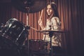Girl behind drums on a rehearsal Royalty Free Stock Photo