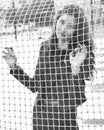 Girl behind the net
