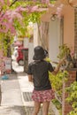 Girl from behind and shisa lion sculpture in naha city street in Okinawa Royalty Free Stock Photo