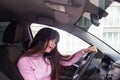 Girl behind the wheel of the car is talking on the phone Royalty Free Stock Photo