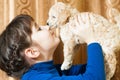 Girl with a beige puppy Royalty Free Stock Photo