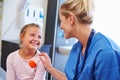 Girl Being Reassured By Nurse In Hospital Room