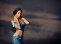 Girl in belly dance costume at sunset Royalty Free Stock Photo