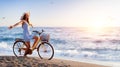 Girl On Bicycle On Beach