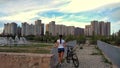 Girl, bicycle and city of Astana