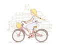 Girl on a bicycle in a European city