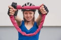 Girl with bicycle lock. Bicycle lock near the bike. Cycling park Royalty Free Stock Photo