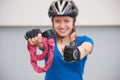 Girl with bicycle lock. Bicycle lock near the bike. Cycling park Royalty Free Stock Photo