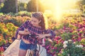 Girl bicycle playing with smartphone in park Royalty Free Stock Photo