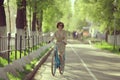 Girl on bicycle at spring morning