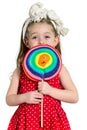 Girl with a big colorful lollipop Royalty Free Stock Photo