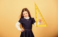 Girl with big ruler. School student study geometry. Kid school uniform hold ruler. School education concept. Learn Royalty Free Stock Photo