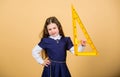 Girl with big ruler. School student study geometry. Kid school uniform hold ruler. School education concept. Learn Royalty Free Stock Photo