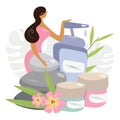 Girl and a big spa set of natural cosmetics. A woman presses a disinfection button. Accessories for SPA, baths and