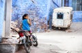 Girl on the bike in Blue city Royalty Free Stock Photo