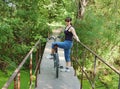 Girl with bike on footbridge Royalty Free Stock Photo