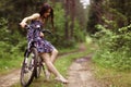 Girl on bike at forest Royalty Free Stock Photo