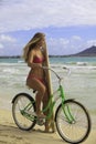 Girl with bike and surfboard Royalty Free Stock Photo