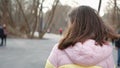 Girl biking in park and hair blowing in the wind