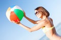 Girl in bikini playing ball on the beach Royalty Free Stock Photo