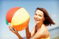 Girl in bikini playing ball on the beach Royalty Free Stock Photo