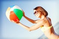 Girl in bikini playing ball on the beach Royalty Free Stock Photo