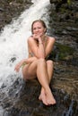 Girl in a bikini on rocks at a Mingo Falls.