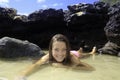 Girl in bikini in a tide pool Royalty Free Stock Photo