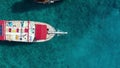 Girl in bikkini lies hammock on the bow of a yacht against the backdrop of the sea. Aerial view 4K.