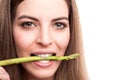 Girl biting asparagus Royalty Free Stock Photo