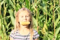 Girl biting corn Royalty Free Stock Photo