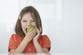 Girl Biting Green Apple