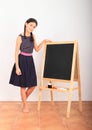 Girl by black blackboard - school education Royalty Free Stock Photo