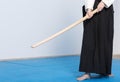 A girl in black hakama standing in fighting pose with wooden sword Royalty Free Stock Photo