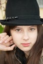Girl in a black hat. Close-up Royalty Free Stock Photo