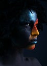 Girl with black make-up and colorful bodypainting