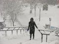 A girl in black outfit in heavy Snow Storm at UWM