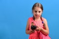 Girl with black retro clock, copy space. School girl Royalty Free Stock Photo