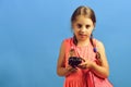 Girl with black retro clock, copy space. School girl Royalty Free Stock Photo