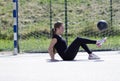 A girl in black sports clothes and white sneakers. Royalty Free Stock Photo