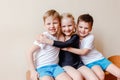 Girl in a black sports swimsuit, boys in white t-shirts Royalty Free Stock Photo