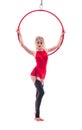 Girl in black stockings holding an air hoop in her hands. red dress. white cyclorama. Royalty Free Stock Photo