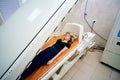 A girl in a black T-shirt lies in a hyperbaric chamber, oxygen therapy Royalty Free Stock Photo