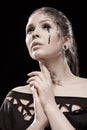 Girl with black tears from eyes and lace pattern on face and neck Royalty Free Stock Photo